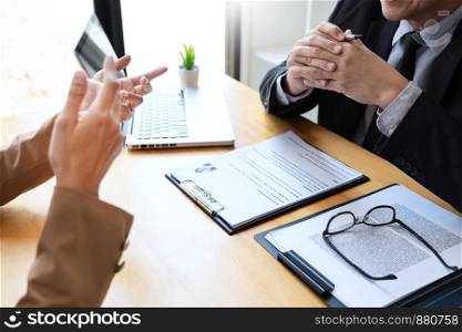 businessman candidate explaining about his profile and conducting a job to managers sitting in job Interview in modern office, consulting or employment concept