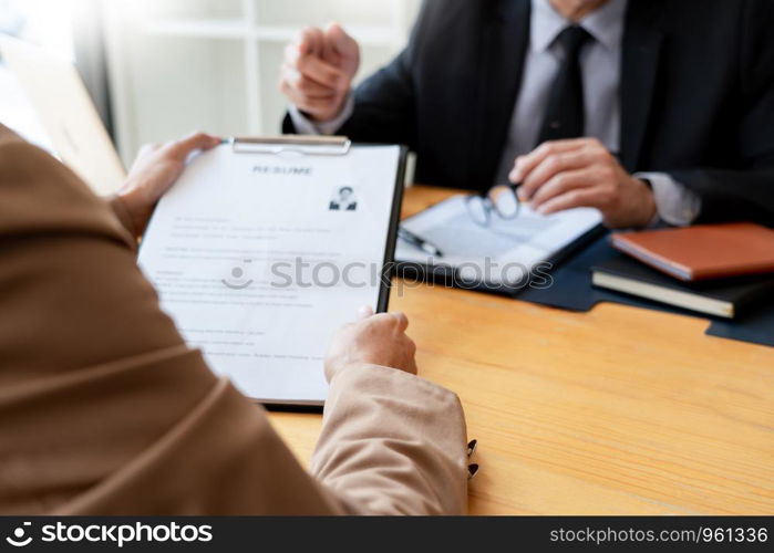 businessman candidate explaining about his profile and conducting a job to managers sitting in job Interview in modern office, consulting or employment concept