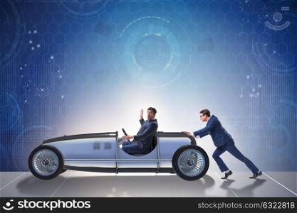 Businessman car pushing in teamwork concept
