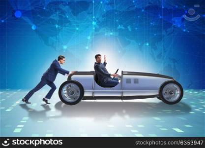 Businessman car pushing in teamwork concept