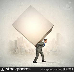 Businessman carrying cube