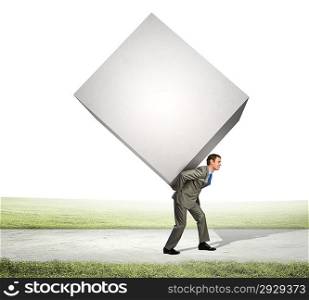 Businessman carrying cube