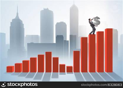 Businessman carrying dollar sign in economic growth concept. The businessman carrying dollar sign in economic growth concept