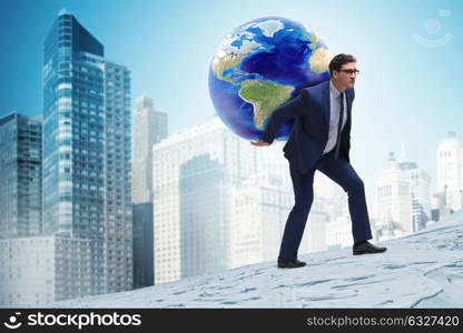 Businessman carrying Earth on his shoulders