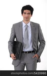 Businessman carrying laptop