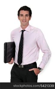 Businessman carrying laptop underarm