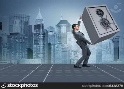 Businessman carrying metal safe in security concept