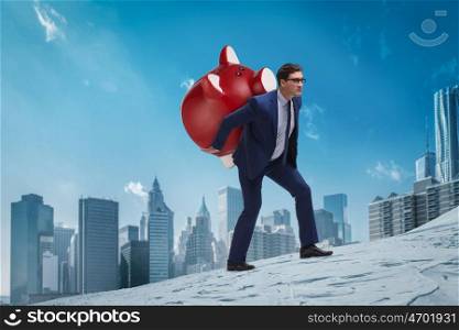 Businessman carrying the piggybank with savings