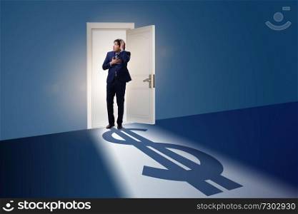 Businessman casting shadow in dollar shape