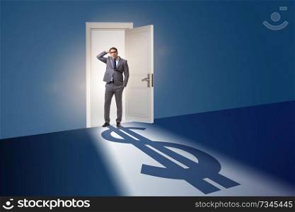 Businessman casting shadow in dollar shape