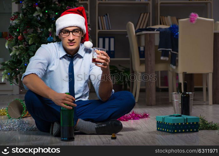 Businessman celebrating christmas at home alone. The businessman celebrating christmas at home alone