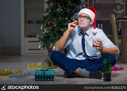 Businessman celebrating christmas at home alone. The businessman celebrating christmas at home alone