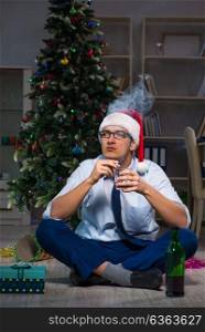 Businessman celebrating christmas at home alone. The businessman celebrating christmas at home alone