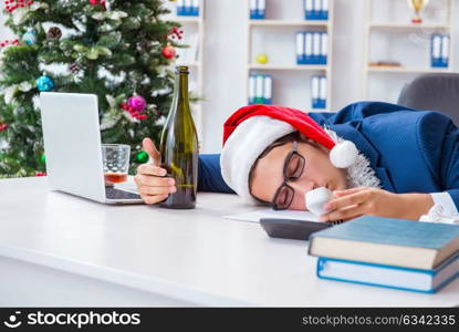 Businessman celebrating christmas holiday in the office