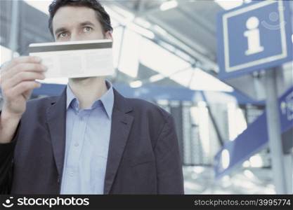 Businessman checking airline ticket