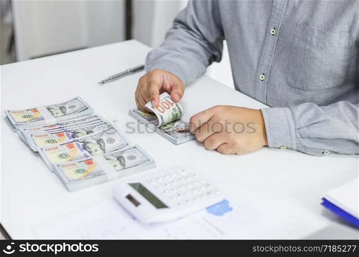 Businessman checking bills taxes bank account balance and calculating annual financial statements of company. Accounting Audit Concept.
