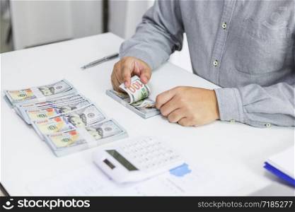 Businessman checking bills taxes bank account balance and calculating annual financial statements of company. Accounting Audit Concept.