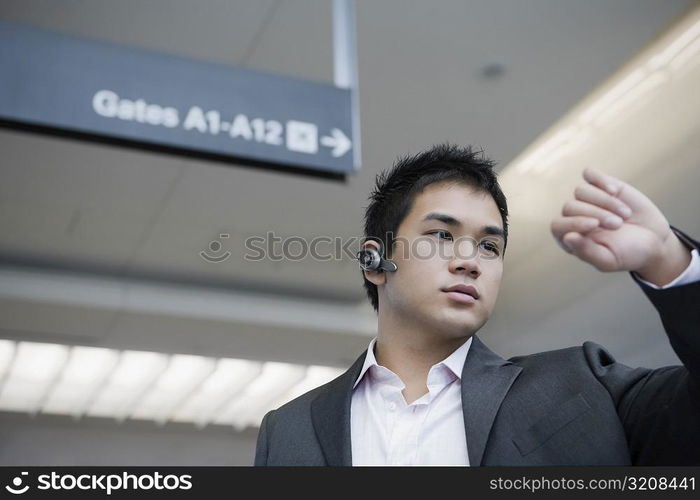 Businessman checking the time at an airport