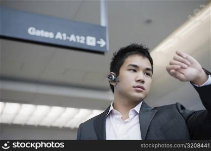 Businessman checking the time at an airport
