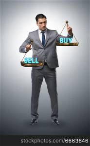 Businessman choosing between buying and selling. The businessman choosing between buying and selling