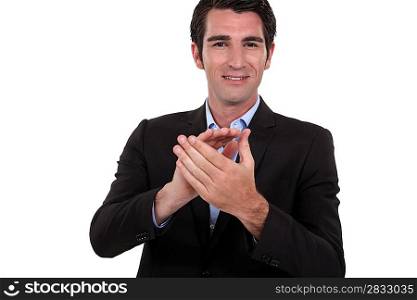 Businessman clapping his hands