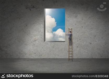 Businessman climbing ladder in business concept