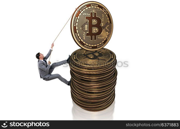 Businessman climbing the stack of bitcoins