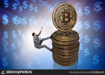 Businessman climbing the stack of bitcoins