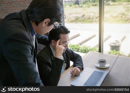 businessman coaching with boss and discussion thinking for working on notebook, working together as team concept background