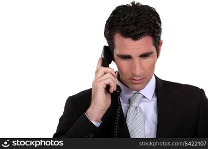 Businessman concentrating during call