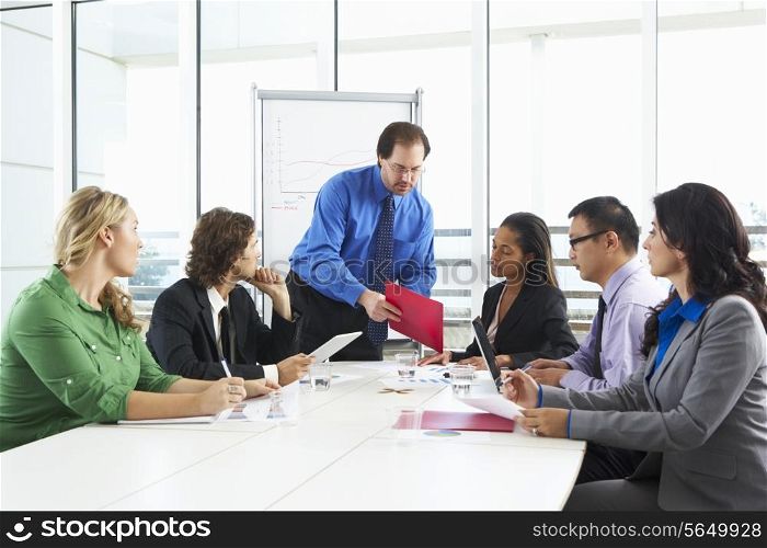 Businessman Conducting Meeting In Boardroom
