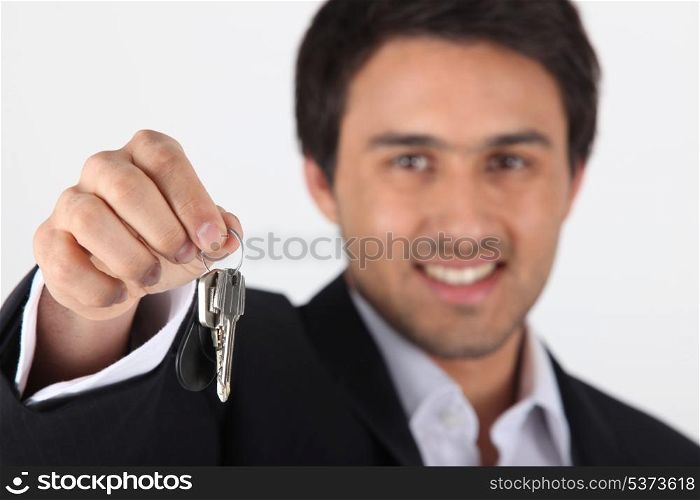 Businessman dangling keys