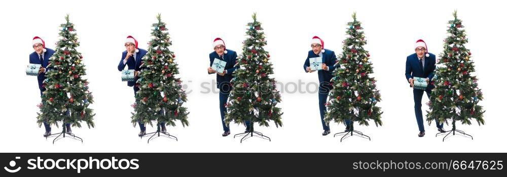 Businessman decorating christmas tree isolated on white