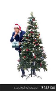 Businessman decorating christmas tree isolated on white. The businessman decorating christmas tree isolated on white
