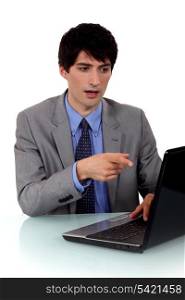 Businessman demonstrating a laptop