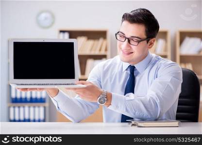 Businessman demonstrating the screen of laptop