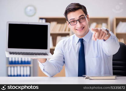 Businessman demonstrating the screen of laptop