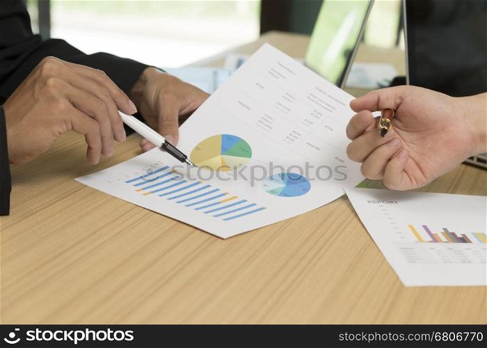 businessman discussing with document, pen, laptop computer for use as working concept