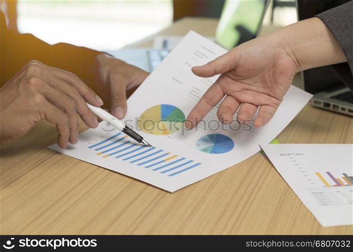 businessman discussing with document, pen, laptop computer for use as working concept