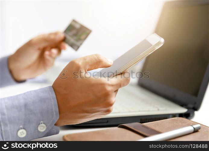 businessman do online shopping with credit card and mobile phone