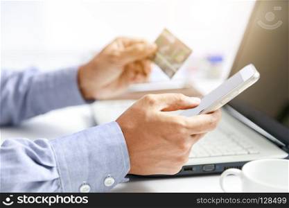 businessman do online shopping with credit card and mobile phone