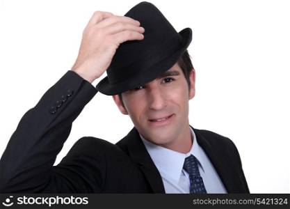 Businessman doffing his hat
