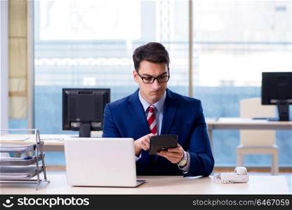 Businessman doing calculations for annual tax return