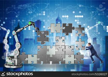 Businessman doing jigsaw puzzle with robotic arm