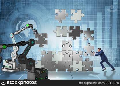 Businessman doing jigsaw puzzle with robotic arm