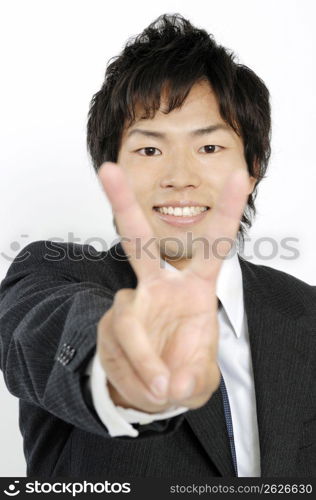 Businessman doing peace sign