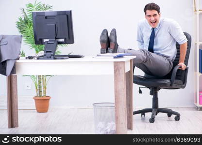 Businessman doing sports in office during break