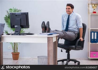 Businessman doing sports in office during break