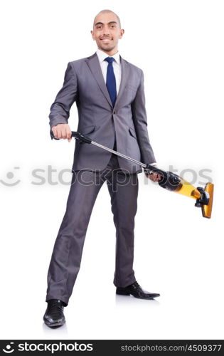 Businessman doing vacuum cleaning on white