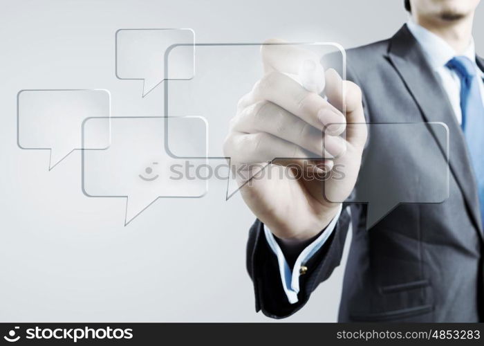 Businessman draw chat balloon. Businessman drawing with marker speech bubble on screen